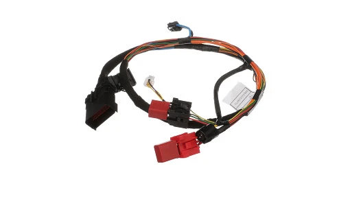 Wire harness for New Holland tractor. Pre-assembled electrical cable routing for cab and engine systems.