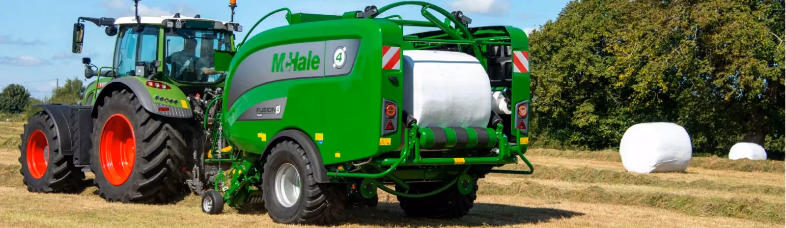 McHale Fusion 4 Plus integrated baler-wrapper making a bale behind a Fendt tractor