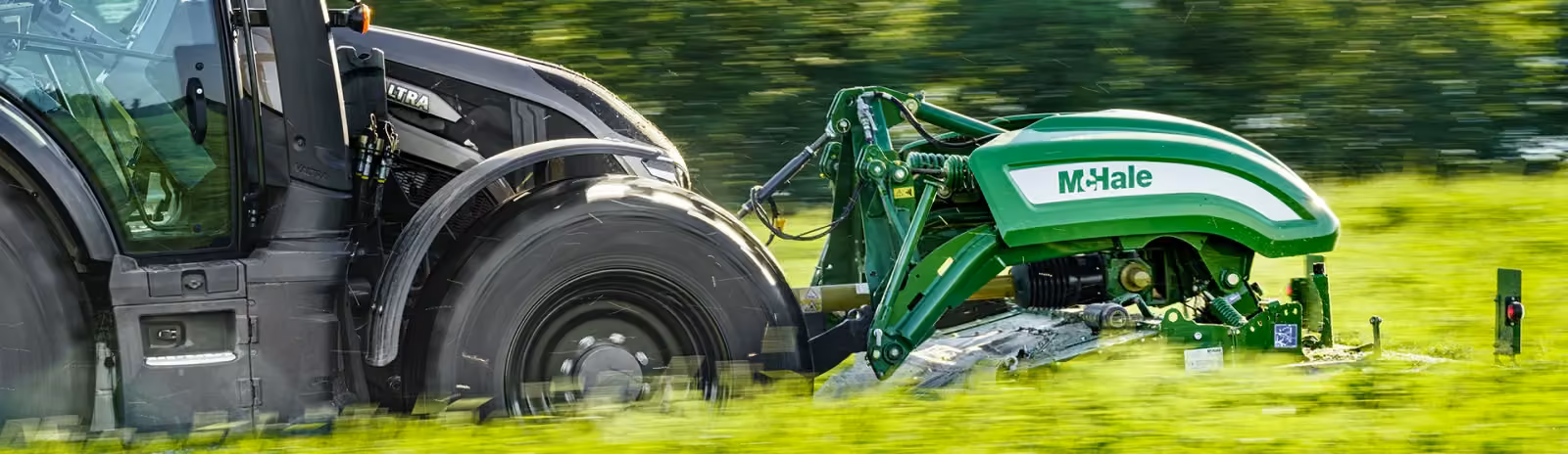 McHale Pro Glide F3100 disc mower cutting grass behind a Valtra tractor